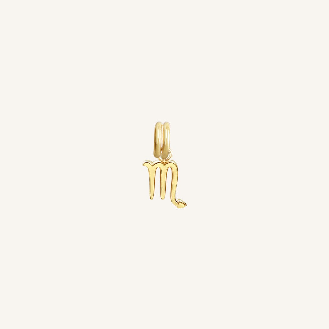 A gold-coloured Petite Zodiac Charm representing the Scorpio sign.