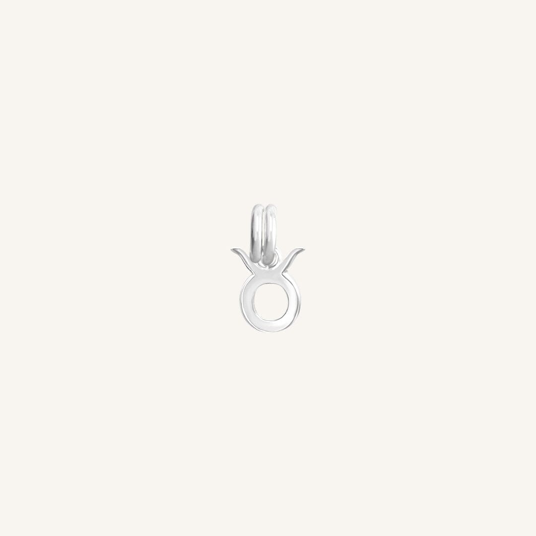 A silver-coloured Petite Zodiac Charm representing the Taurus sign.