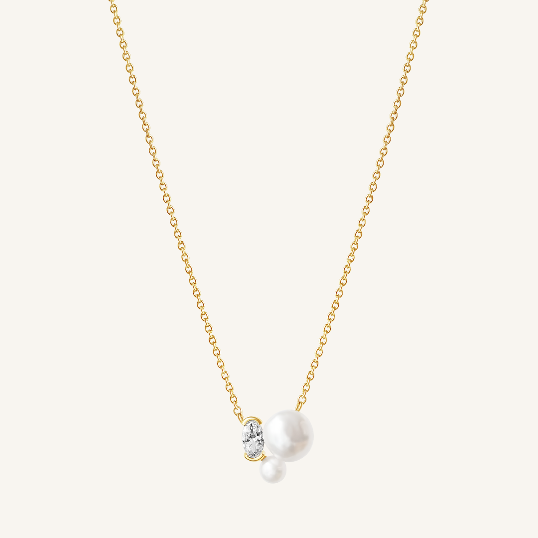 A gold chain necklace with a single pearl pendant in the center, displayed against a white background.