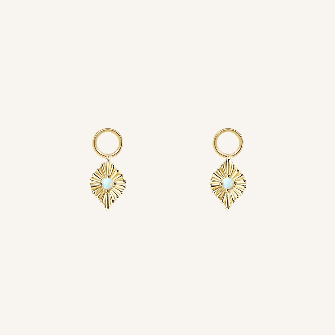 A pair of gold diamond shaped hoop charms featuring a faux opal
