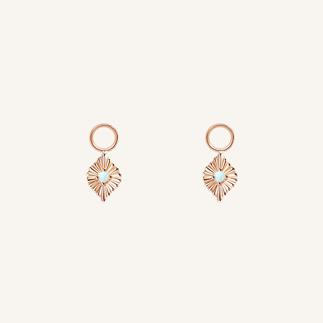 A pair of rose diamond shaped hoop charms featuring a faux opal
