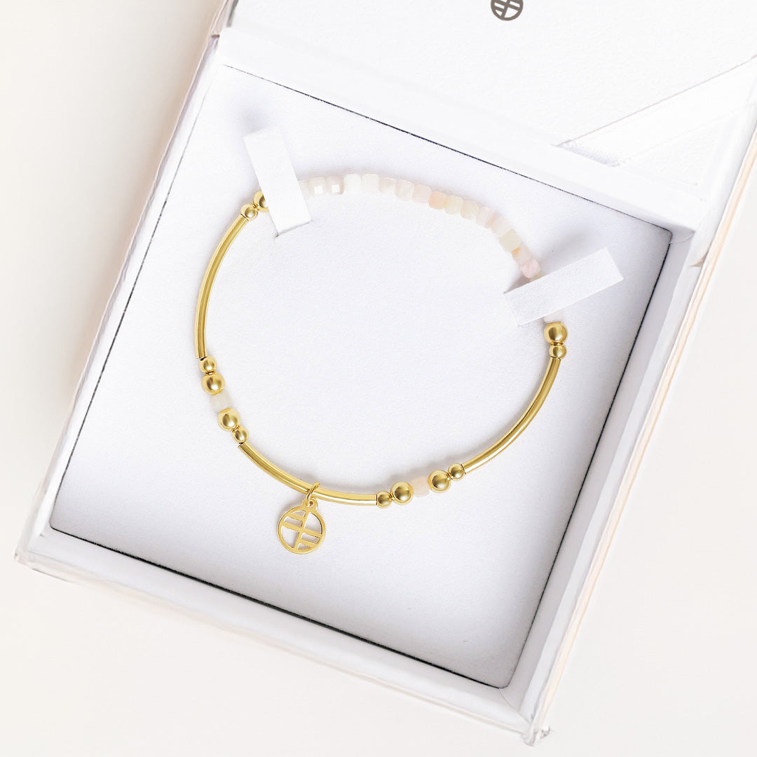 Gold bracelet with in a white box