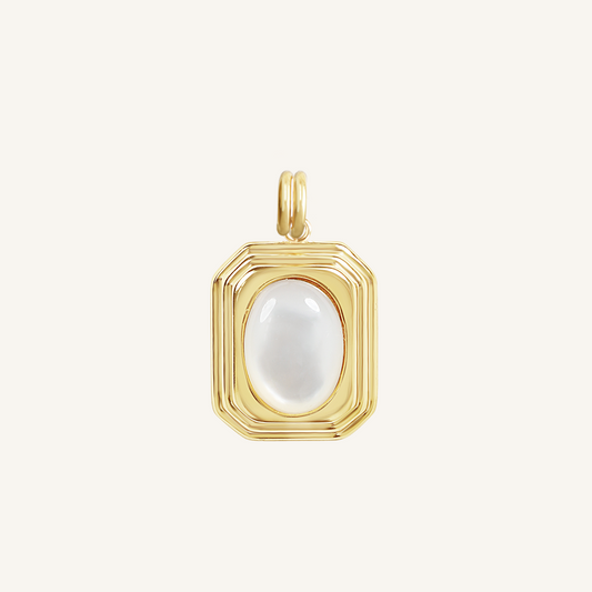 A gold-colored pendant with an oval mother-of-pearl stone in the center, isolated on a white background.