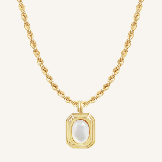 A gold-colored necklace with a square-shaped pendant featuring a mother-of-pearl stone.