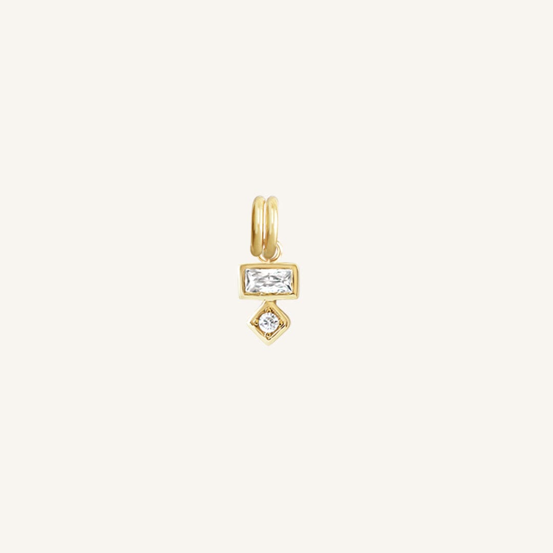 Petite gold charm with a rectangular and a round cubic zirconia, designed to be attached to a bracelet or necklace