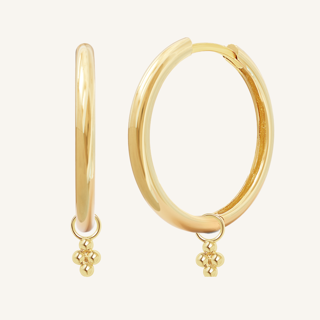 A pair of gold-tone hoop earrings with bobble details.