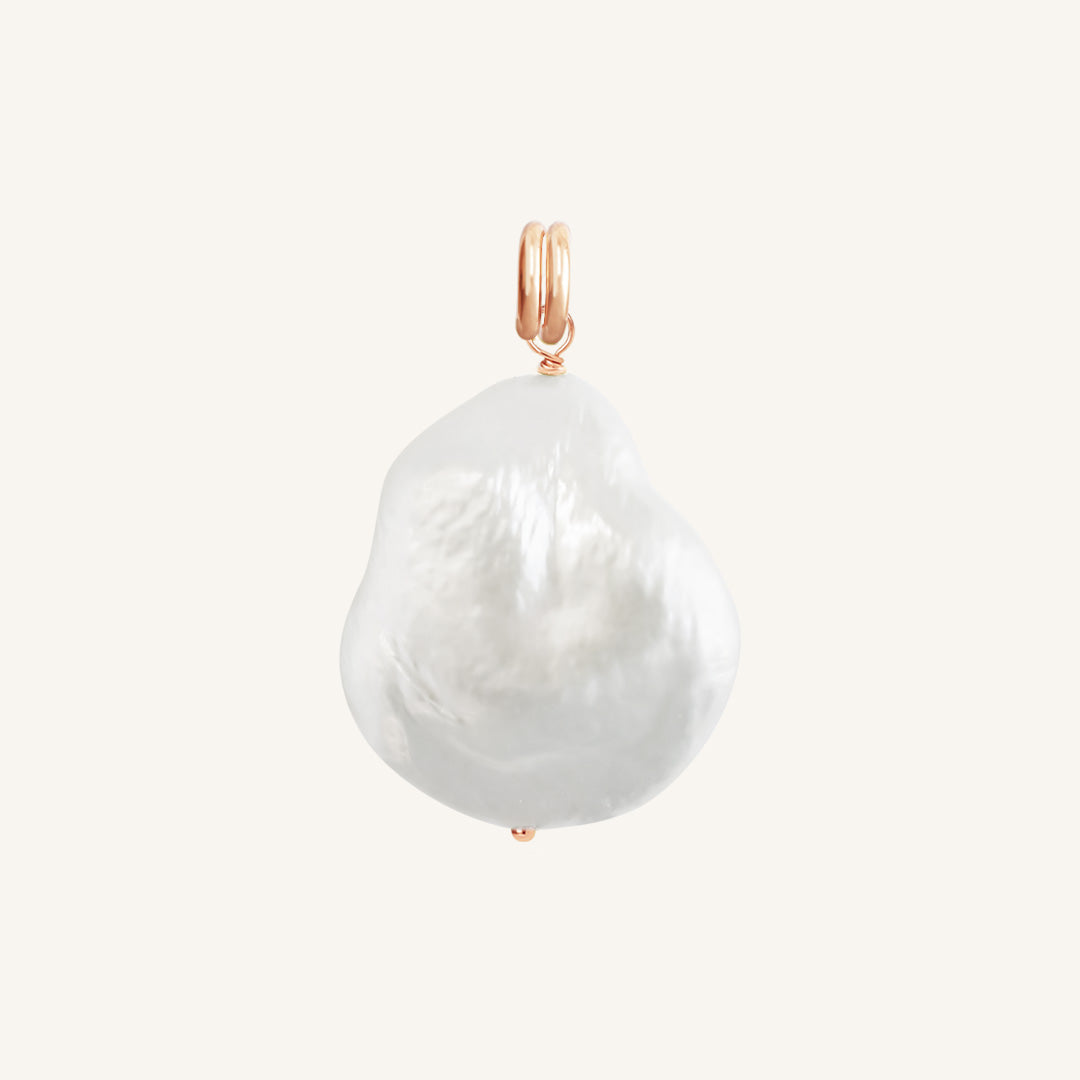 A single river pearl charm with rose findings, presented against a white background.