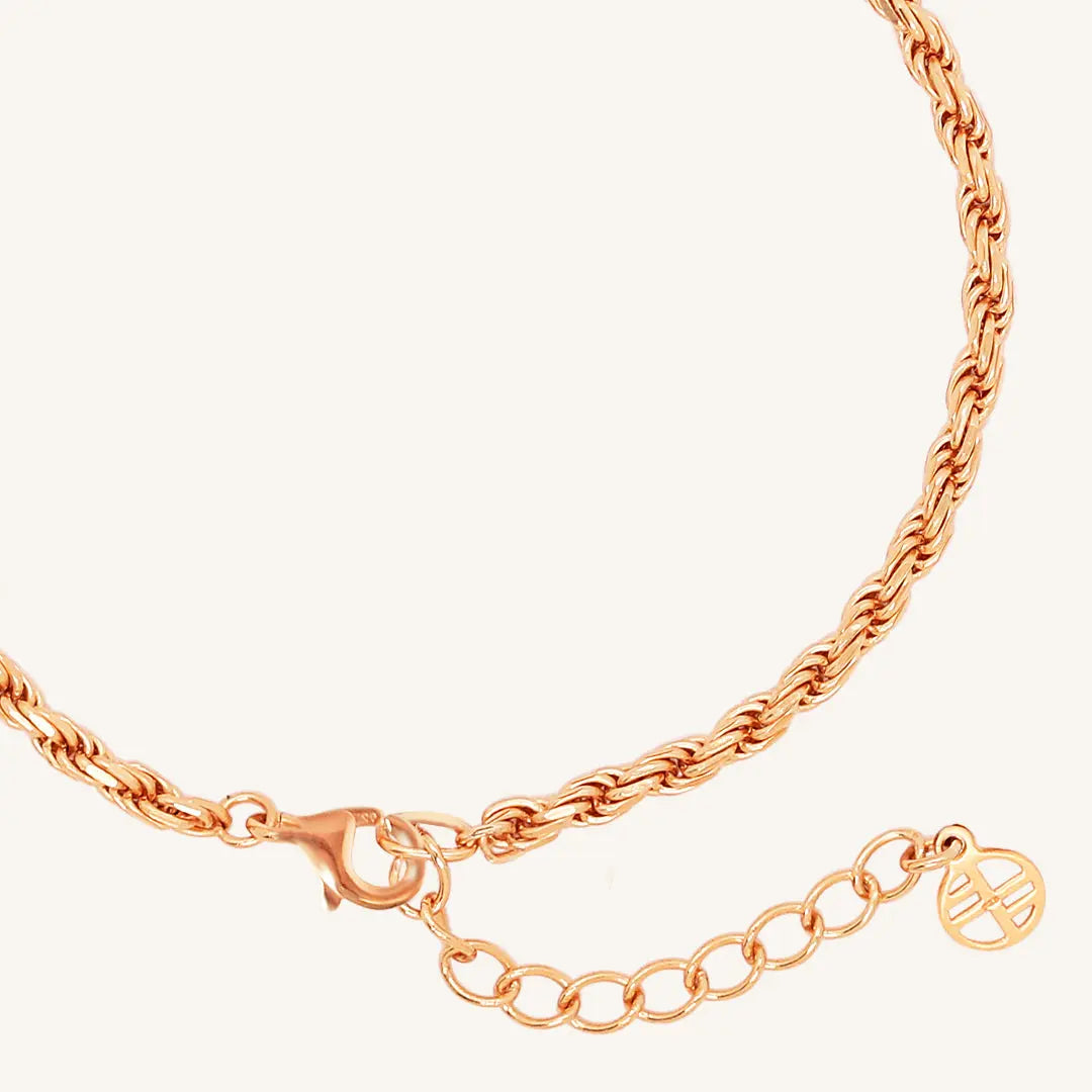 A rose-tone rope bracelet with a extender chain