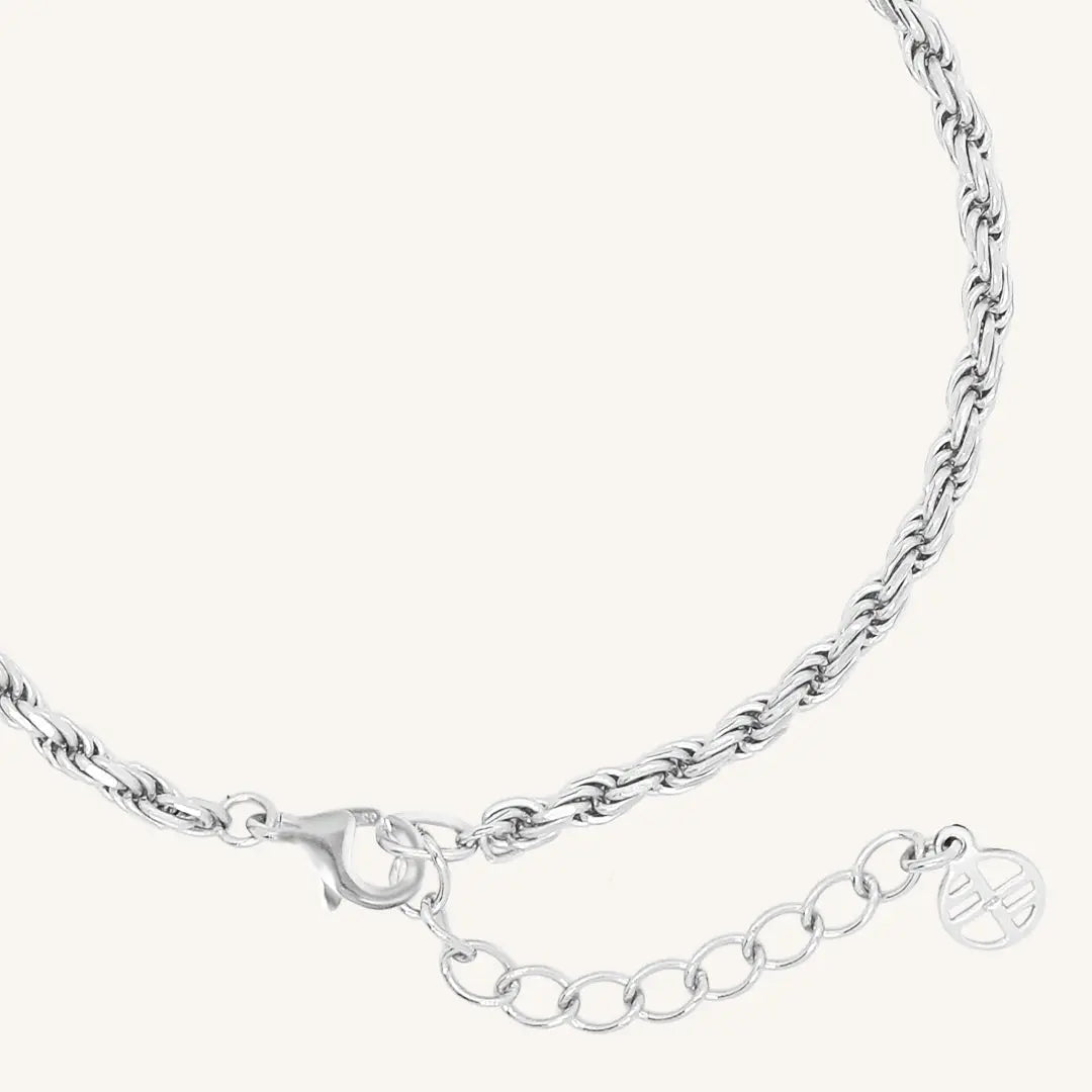 A silver-tone rope bracelet with a extender chain