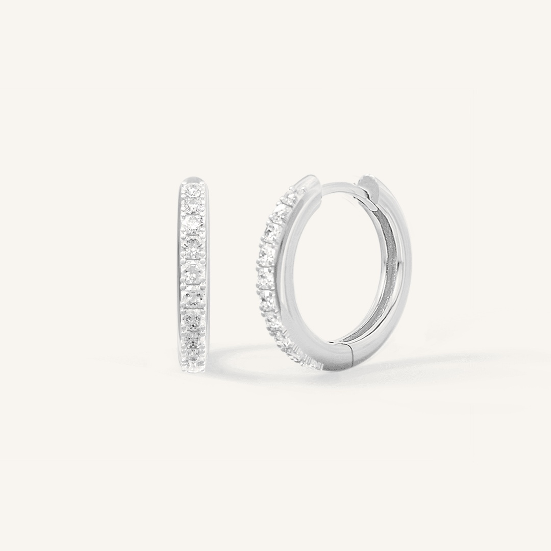 Small silver hoops, with cubic zirconias wrapped around