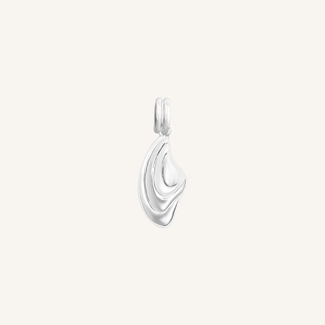 Silver pendant on a light gray background