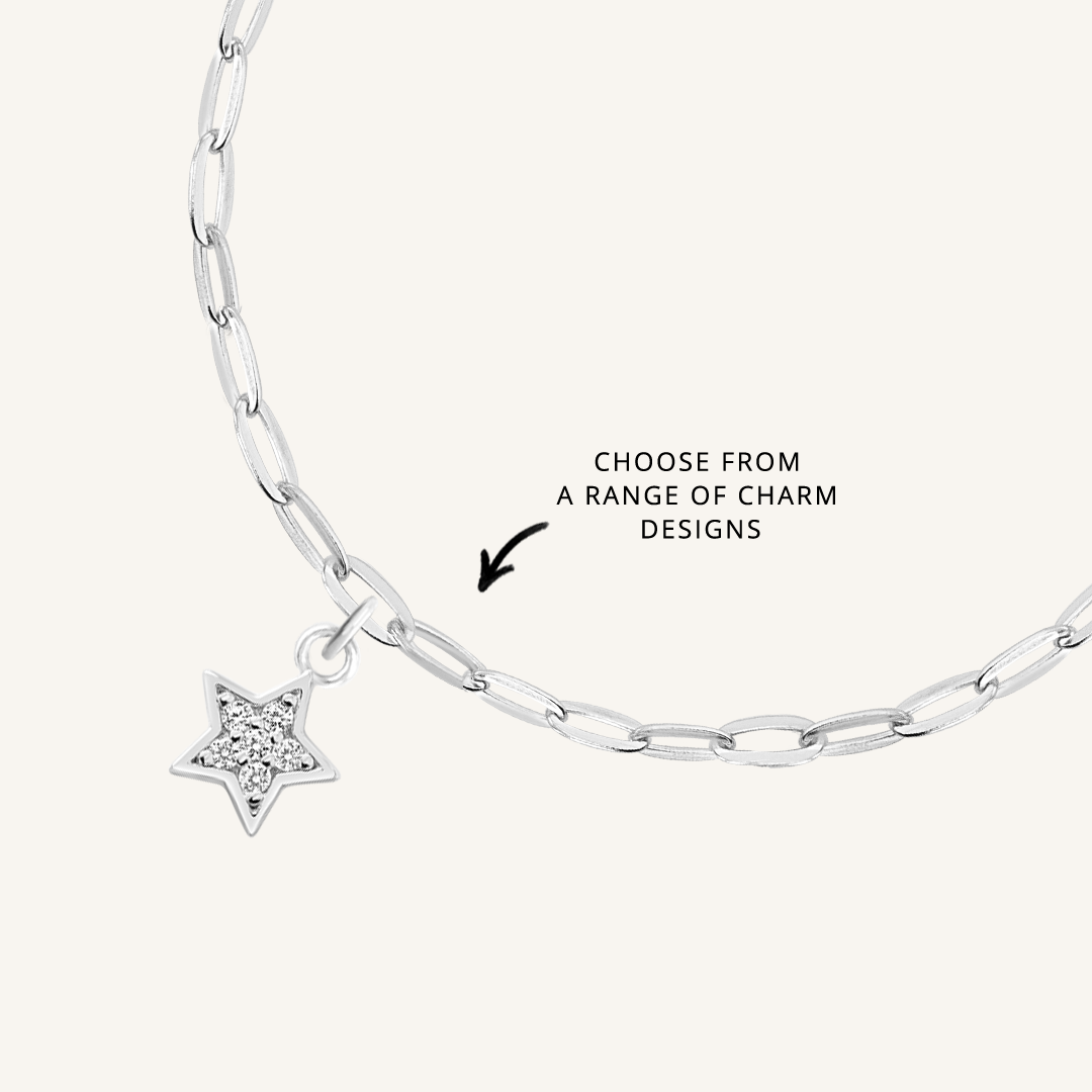 close up on silver chain with soldered charms