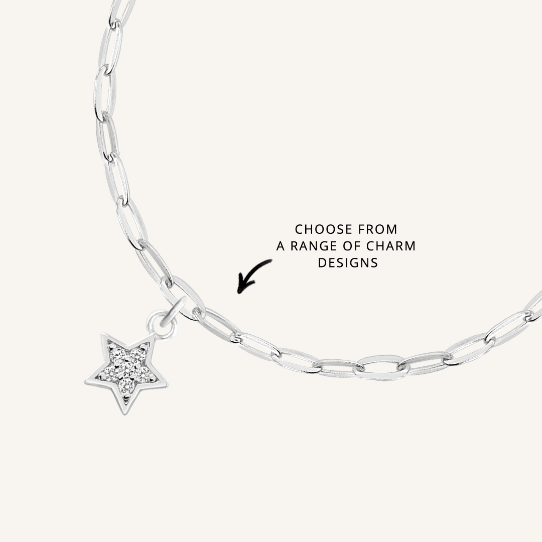 close up on silver chain with soldered charms