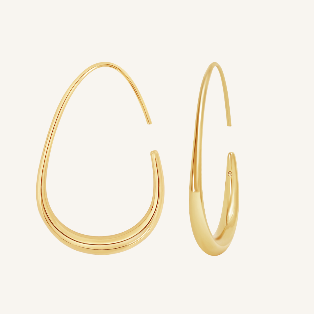 Gold hoop earrings on a white background