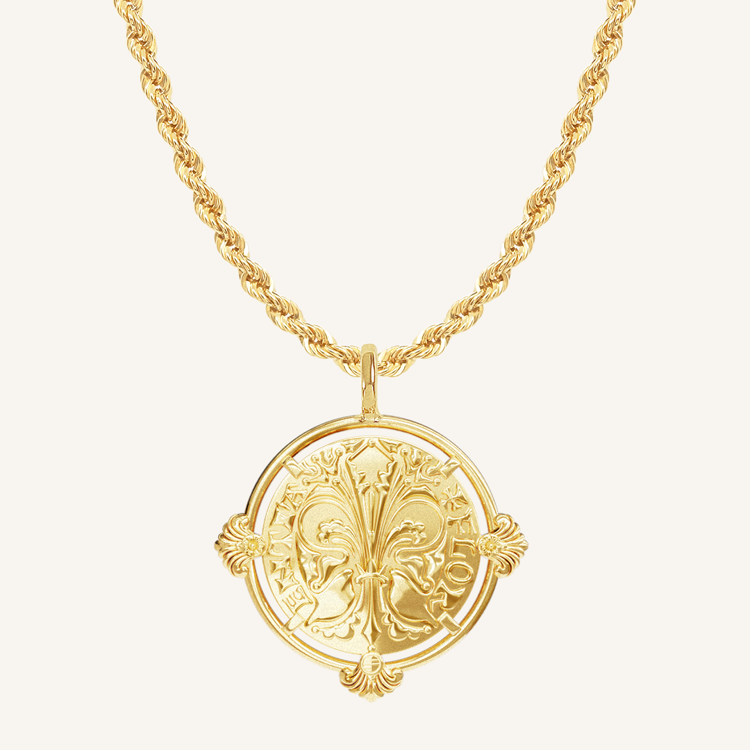 gold pendant featuring intricate patterns inspired by Palace of Versailles on gold rope chain a plain background