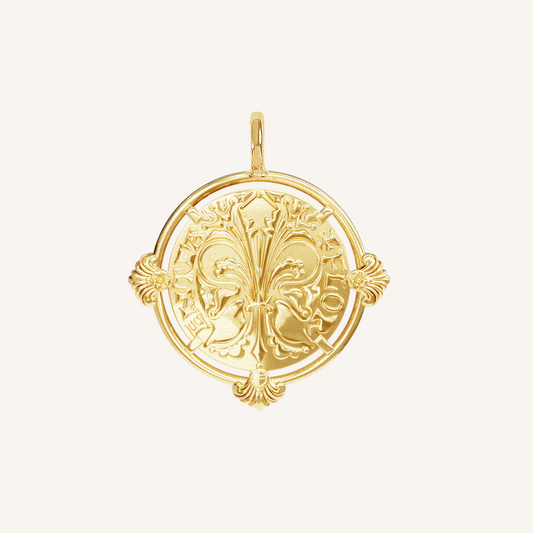 gold pendant featuring intricate patterns inspired by Palace of Versailles on a plain background