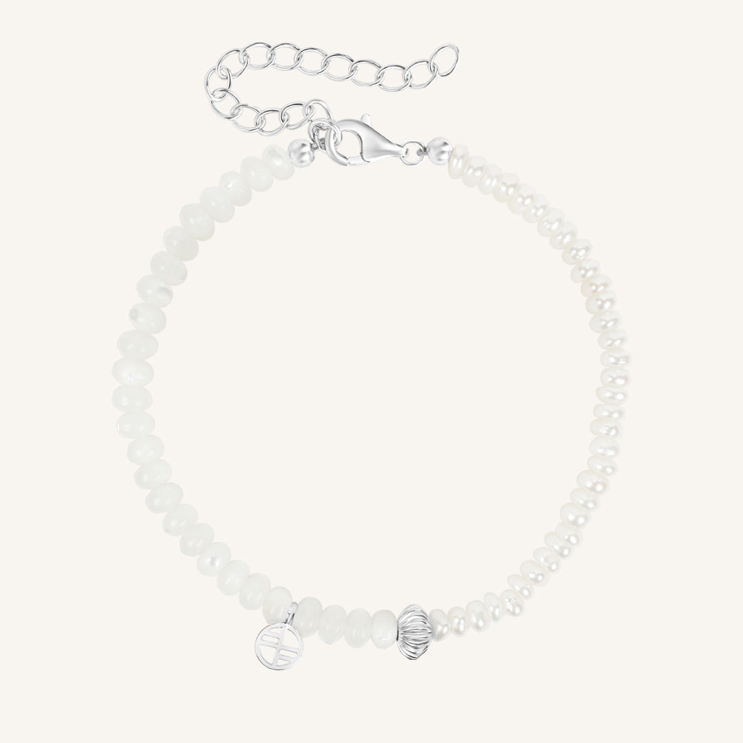 Silver bracelet with beads on a white background