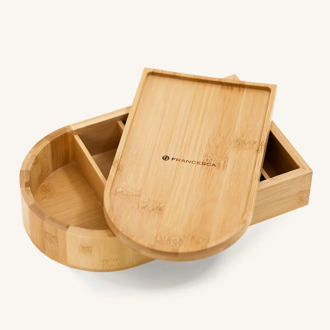 A wooden jewellery box with a lid, featuring a mirror on the inside lid, with the brand name 'Francesca' visible.