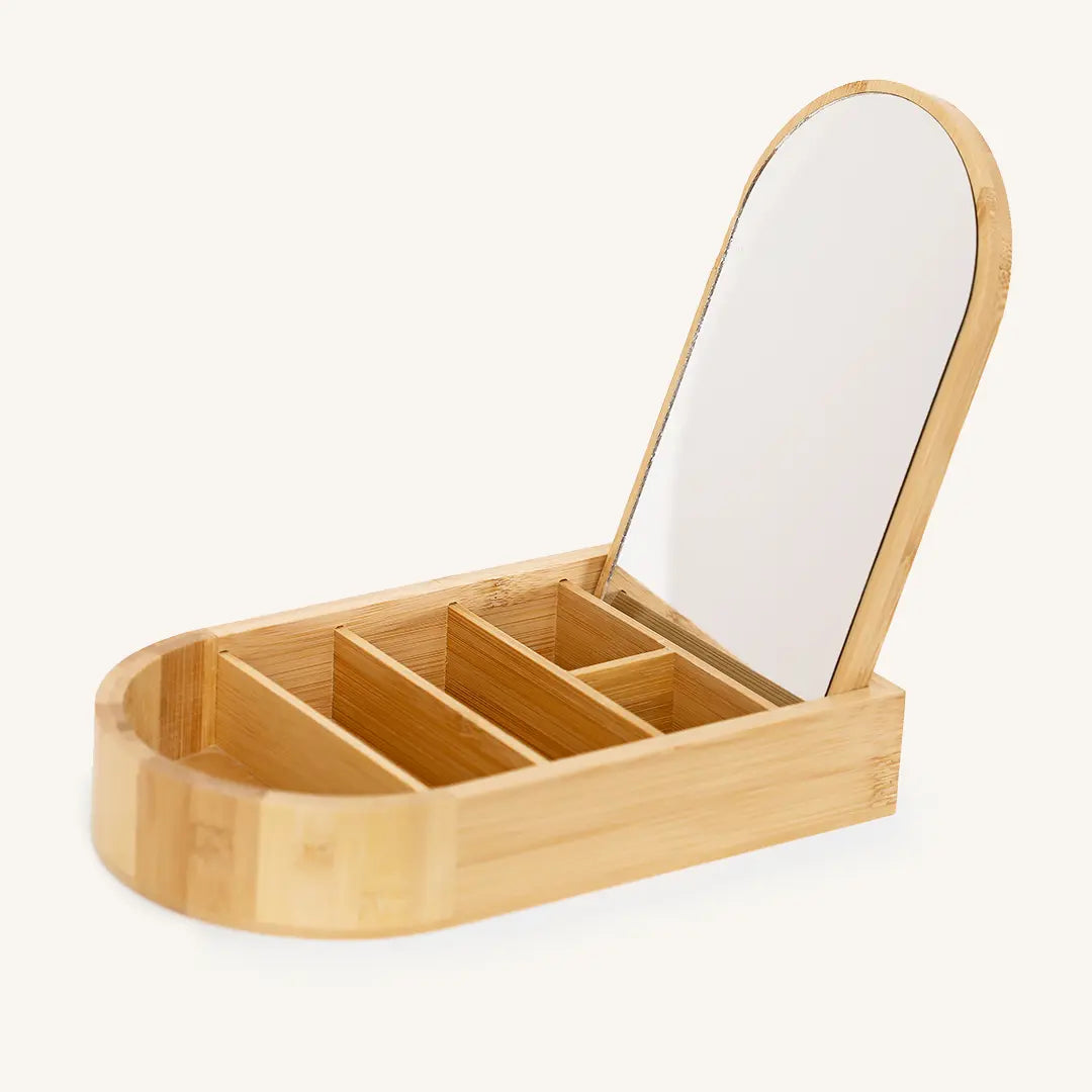 A wooden jewellery box with a lid, featuring a mirror on the inside lid, with the brand name 'Francesca' visible.