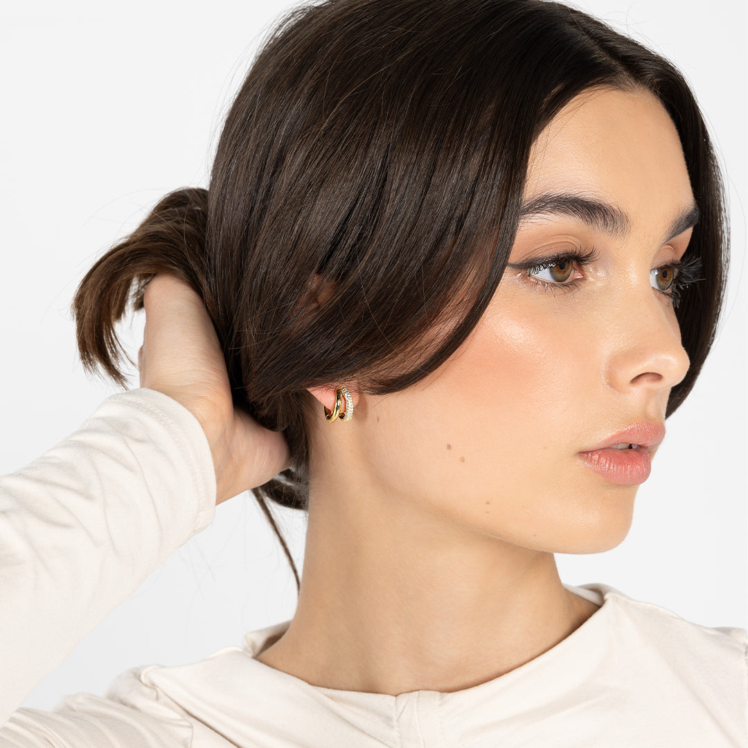 gold double hoop worn in ear