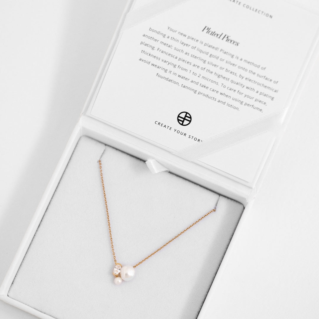 Pia pearl necklace displayed in white box
