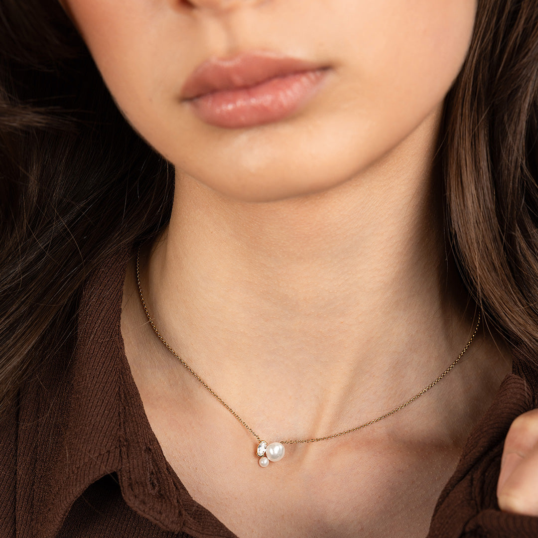 close up of necklace around models neck