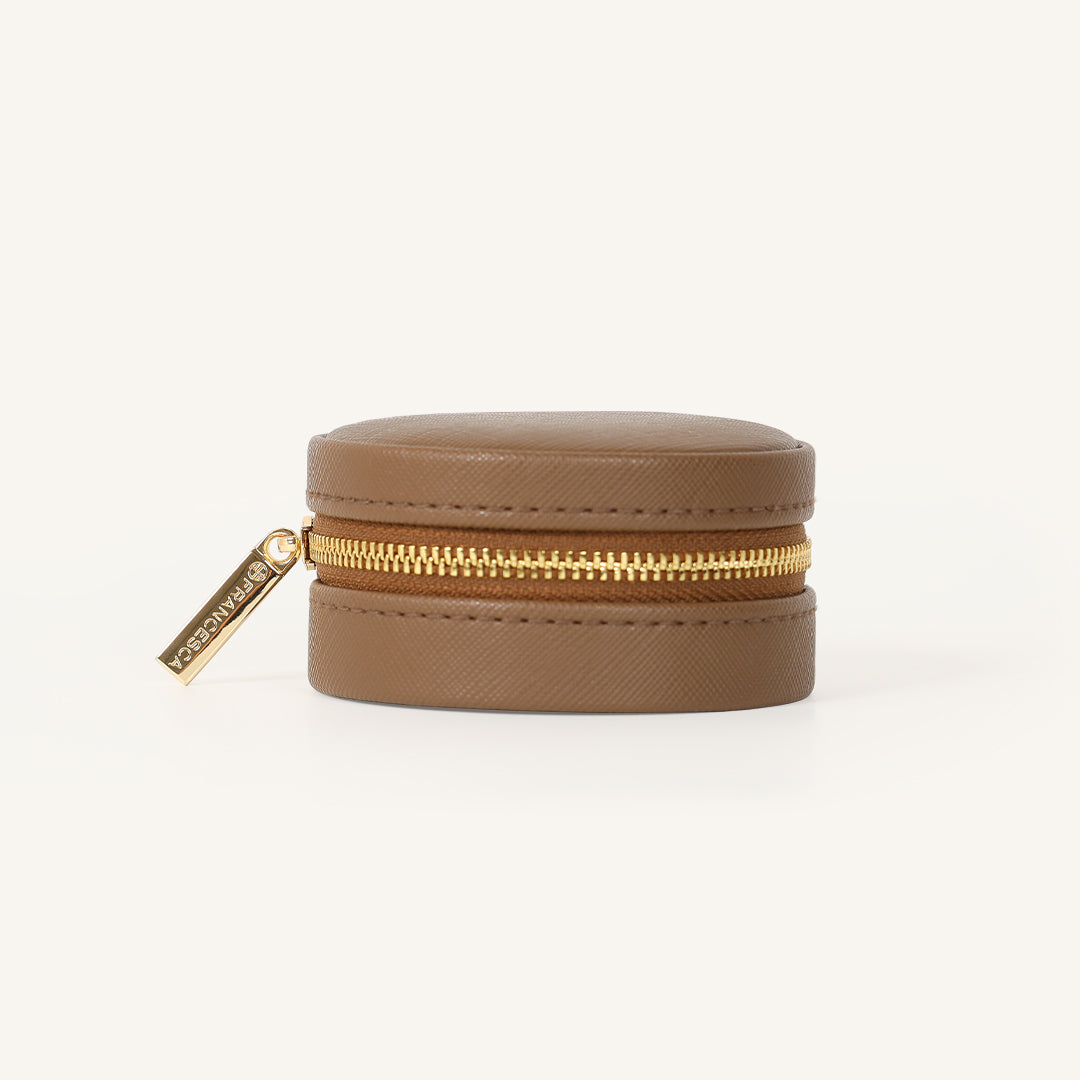 A compact round Sienna Jewellery Box made of Brown Vegan saffiano leather.