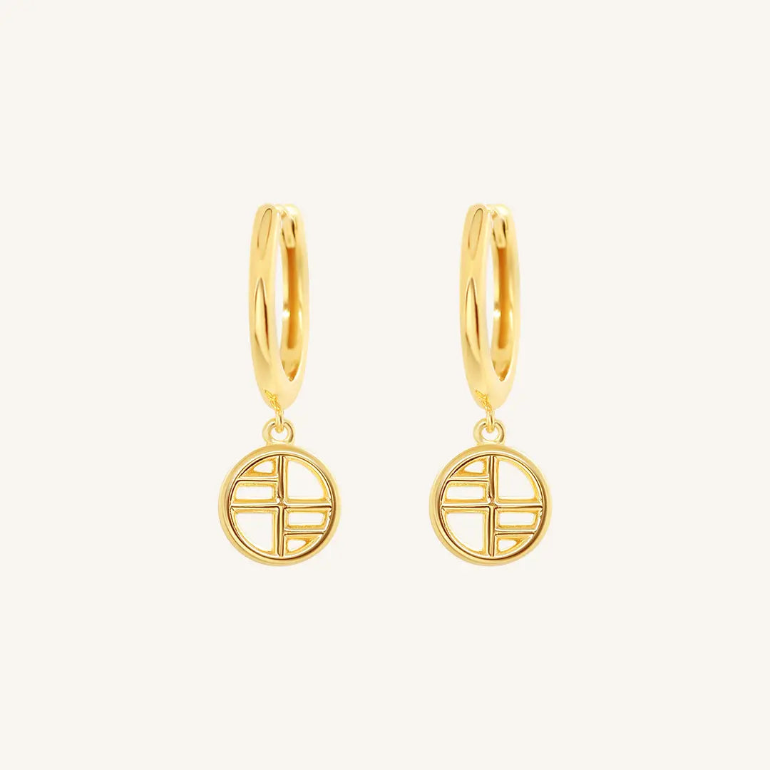 A pair of gold-tone drop earrings with the francesca logo