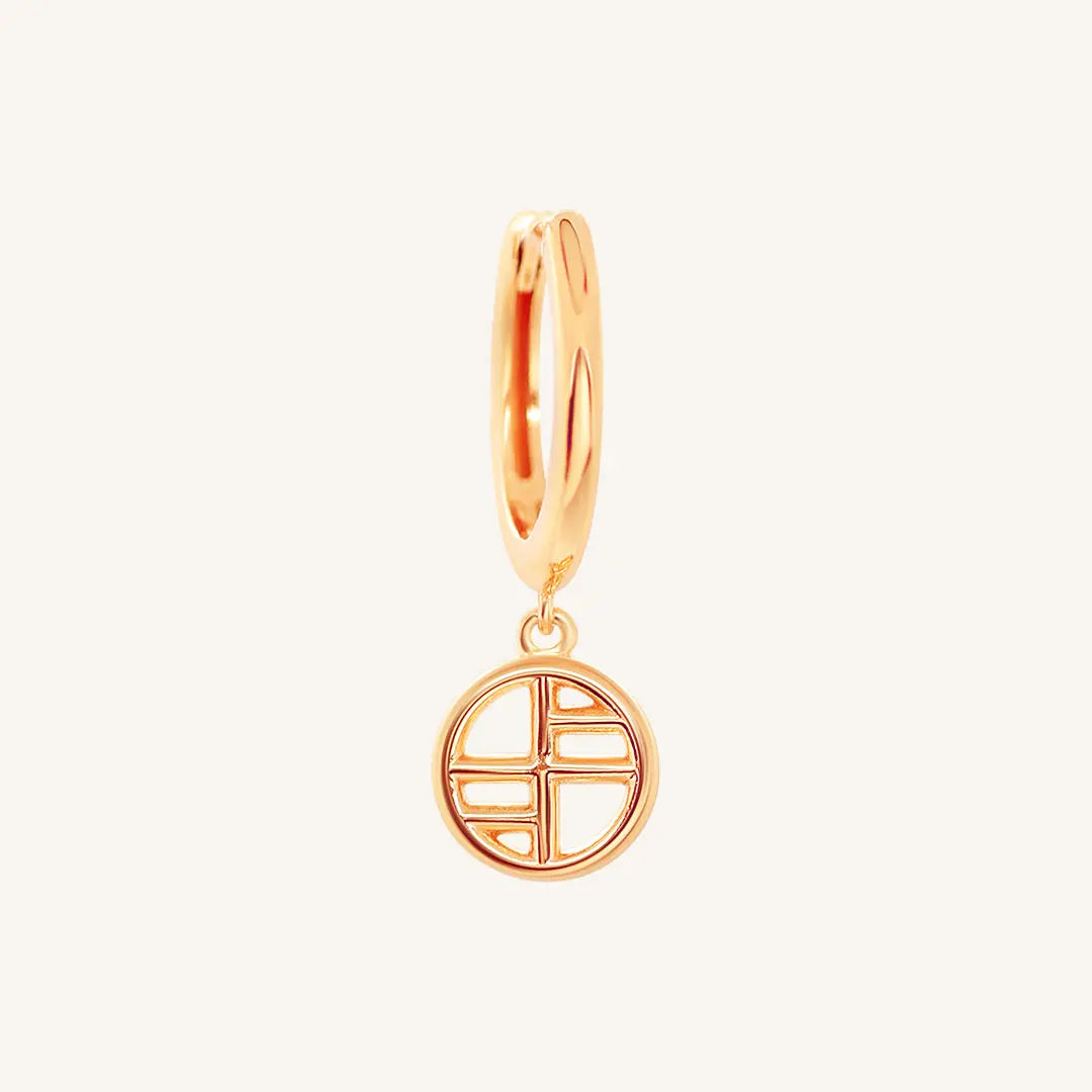 A rose-tone drop earring with the francesca logo