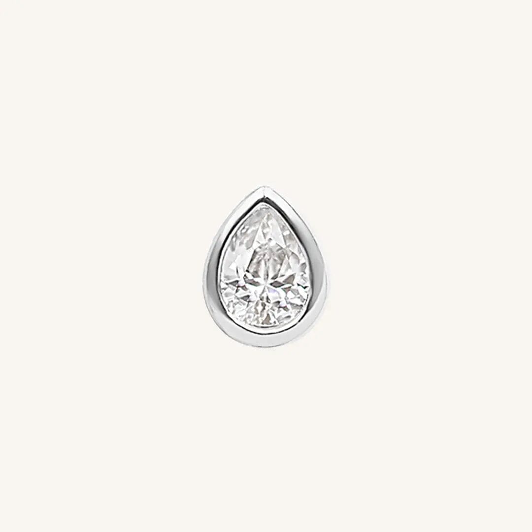 A pair of teardrop-shaped cubic zirconia stud earrings set in silver-tone settings.