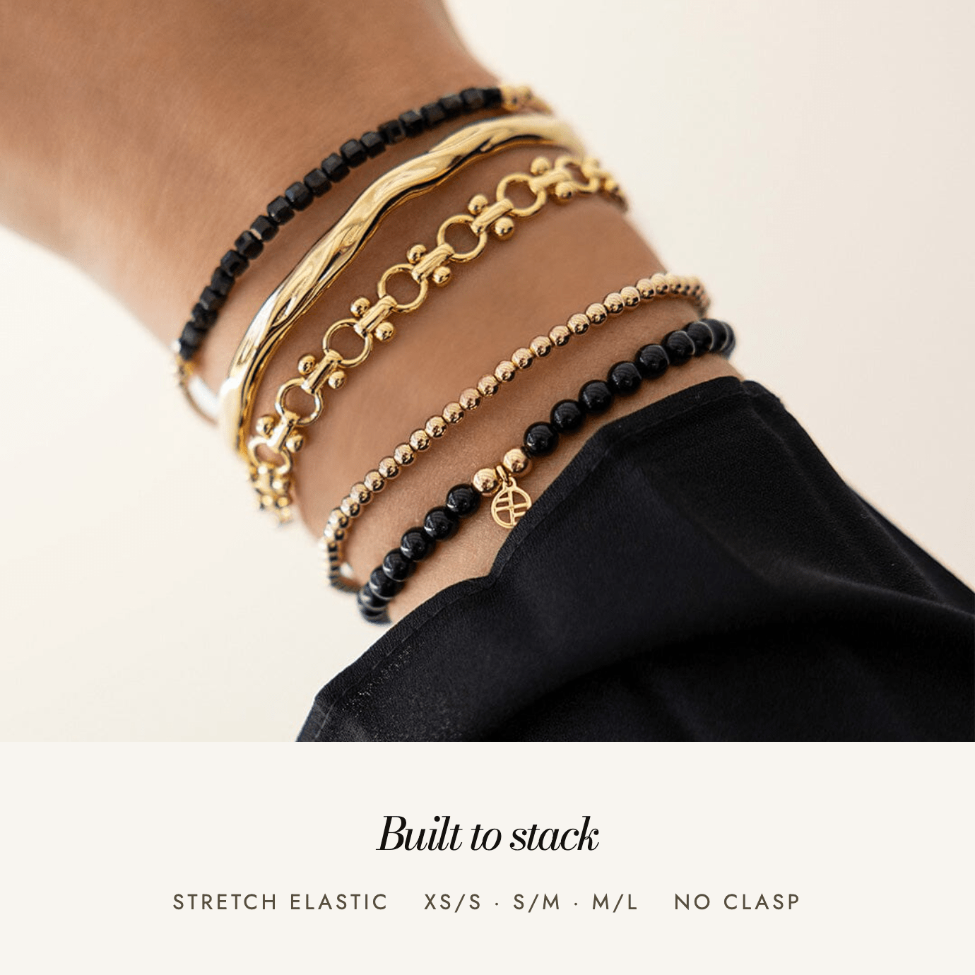 Black Spinel Division Charm Bracelet: built to stack, stretch elastic, sizes XS/S to M/L