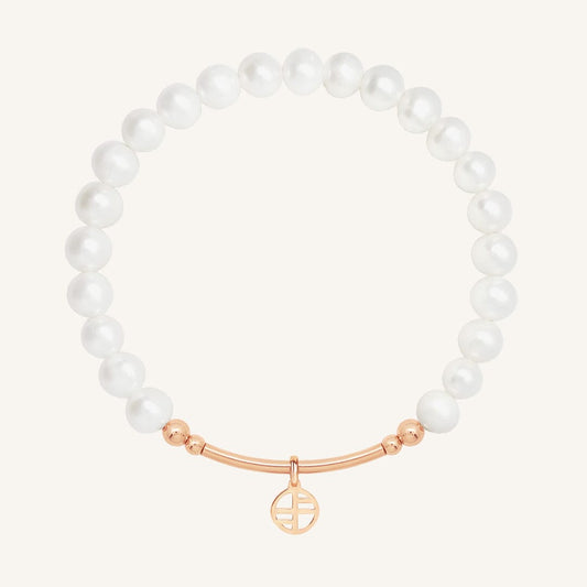 Pearl bracelet with a rose gold clasp on a white background