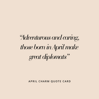 A gold birthstone charm with a white cubic zirconia representing the month of April.