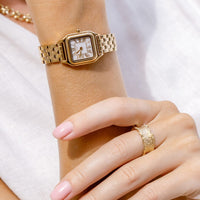 A silver-toned Louis Watch with a link bracelet and a square face featuring Roman numerals.