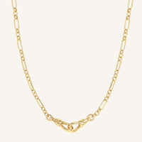 Gold chain necklace on a white background