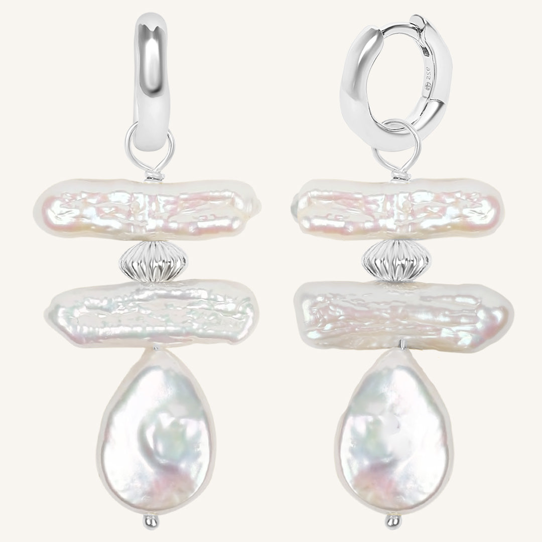 Pair of pearl earrings on a white background