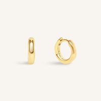 Gold hoop earrings on a white background