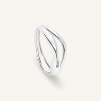 Silver ring on a light gray background