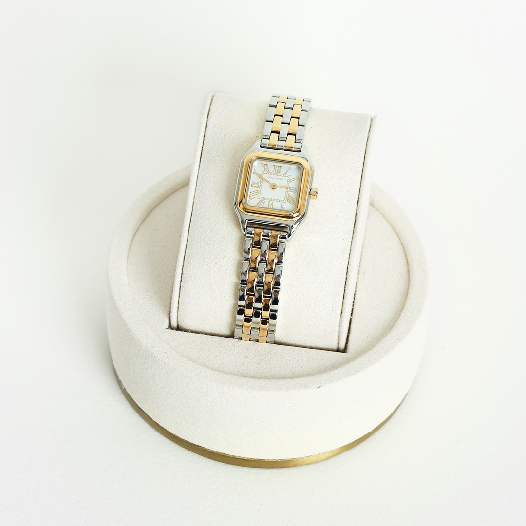 A two-toned Louis Watch with a link bracelet and a square face featuring Roman numerals.