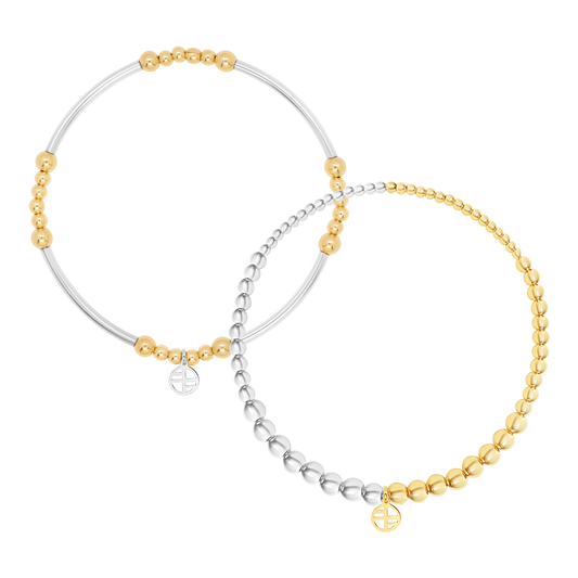Two beaded bracelets, one silver and one gold, on a white background.