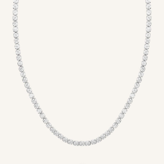 A tennis chain necklace with silver metal tone.