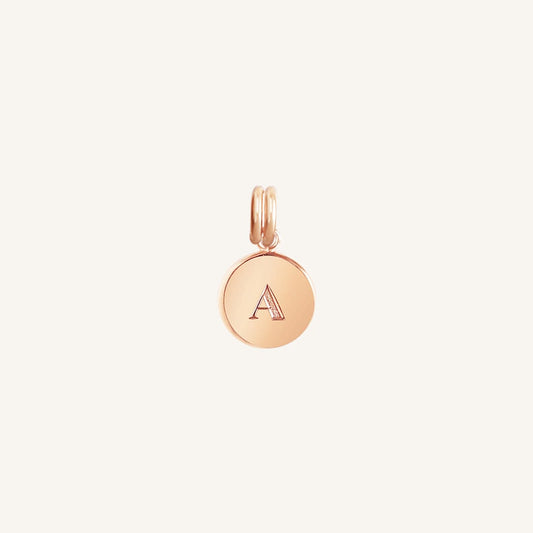 A rose round charm with the letter 'A'  on it, presented against a white background.