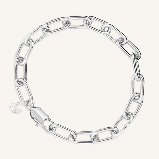 A chunky link style bracelet in silver tone, featuring a clasp closure.