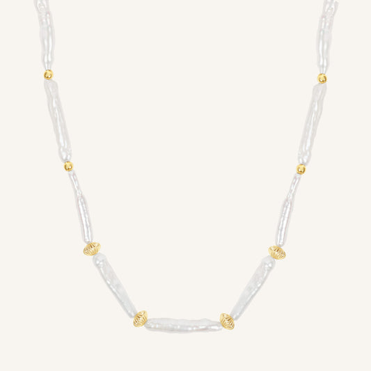 Necklace with white beads and gold accents on a white background