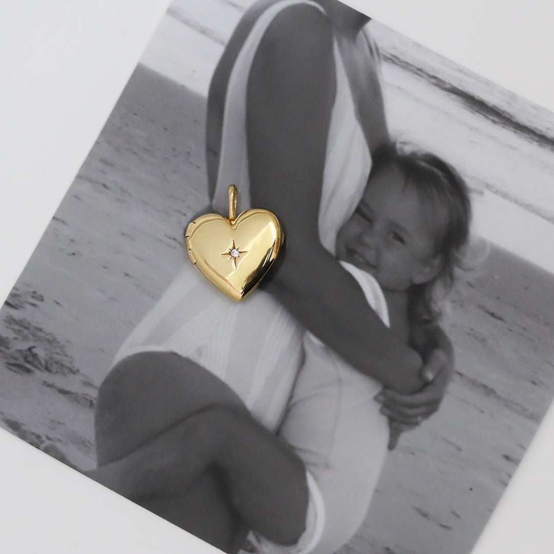 A gold heart-shaped photo locket