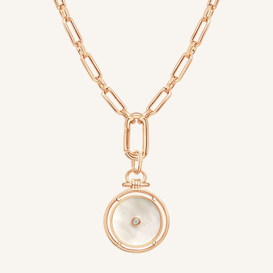 Rose gold necklace with a pendant on a white background