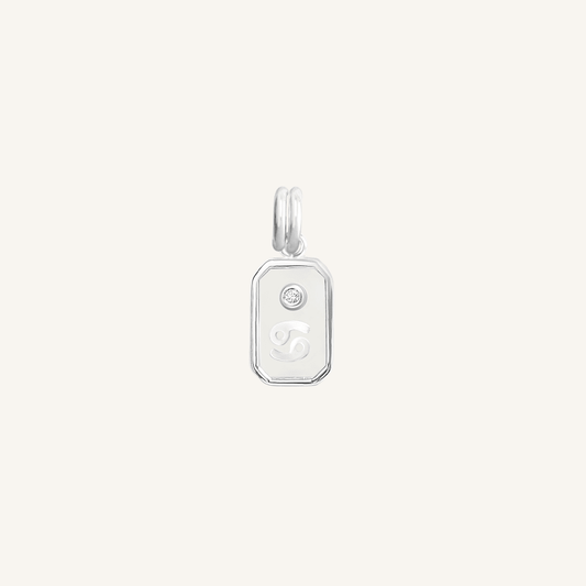 A silver rectangular shaped charm with the Cancer zodiac symbol on it, designed with an iridescent finish.