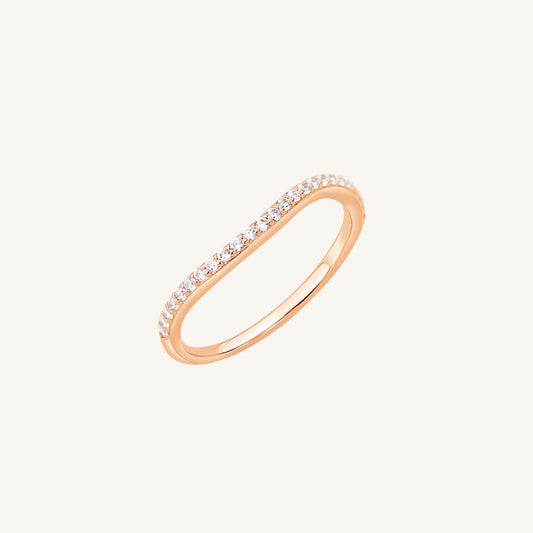 A slim, elegant ring with multiple small cubic zirconias set in a rose gold coloured band.