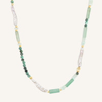Necklace with green and white beads on a white background