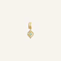 A gold birthstone charm with a blue cubic zirconia representing the month of December.
